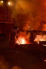 Steel foundry worker at blast furnace workshop.