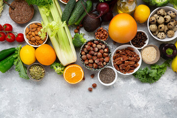 Overhead view of vegetables on light surface, cooking and clean eating concept