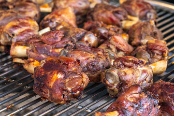Pork shanks on the grill, closeup, outdoor picnic.