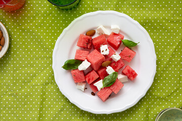 Summer salad feta watermelon slices top view white plate