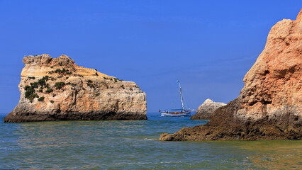 Fototapeta na wymiar Tourist sailboat off the Praia da Prainha Beach. Alvor Portimao-Portugal-303