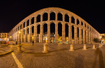 Panoramic night photo of the aqueduct of Segovia in a summer night, Spain.