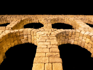 Night photo of the aqueduct of Segovia in a summer night, Spain.