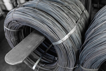 Iron wire in roll. Warehouse of metal products.
