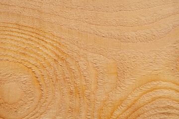 light brown wooden board background. annual rings on a tree