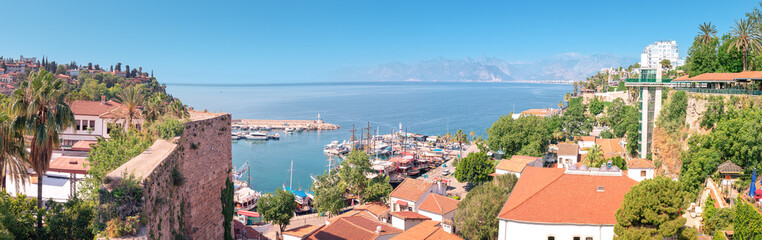 Naklejka na ściany i meble Aerial view of the picturesque bay with marina port with yachts near the old town of Kaleici in Antalya. Turkish Riviera and resort paradise