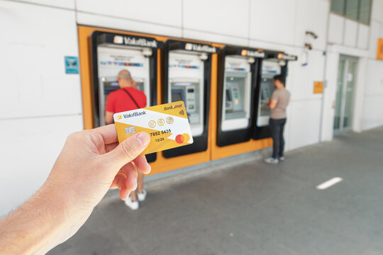 18 May 2022, Antalya, Turkey: Vakif turkish bank plastic card against the background of ATMs in which customers withdraw or deposit money into the account