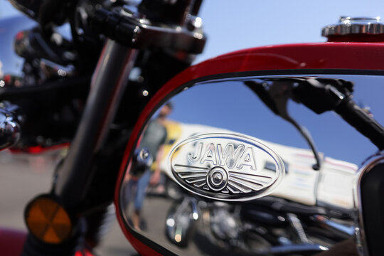 Koprivnice, Czech Republic, Czechia - 5 June, 2022: Jawa moto - fuel tank with logo and brand of motorcycle and motorbike manufacturer. Detail of vehicle. Very shallow focus.