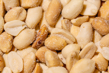 Dry Peanuts Salted Roasted without skin top view background or texture. Healthy spices, nuts, seeds and herbal products. Macro photo.