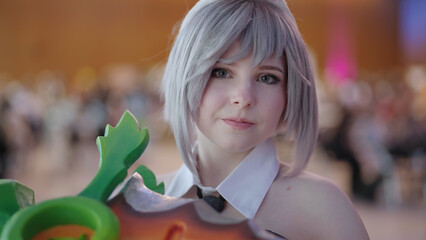 Portrait of Battle Bunny Riven cosplay girl with carrot sword at comic con