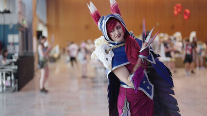 Comic con cosplay character Xayah from League of Legends game pose - obrazy, fototapety, plakaty
