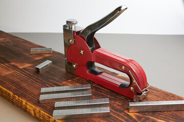 construction stapler with staples on the board