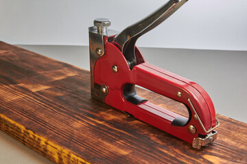 construction stapler with staples on the board