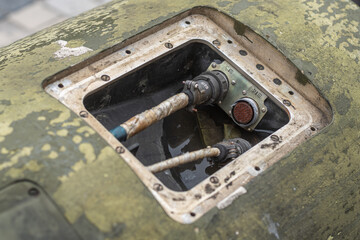 Electronics inside a russian missile Point U. Military connector with a thick cable in military equipment.