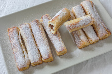 Puff pastry bars with chocolate and wafer filling.