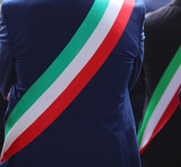 Italian mayor with green white and red band with blue elegant new suit