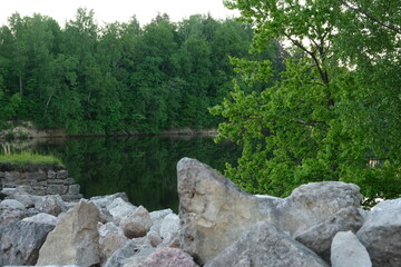 Fototapeta na wymiar rocks in the forest near river