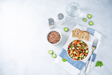 Lentil red bell pepper cucumber salad in a bowl