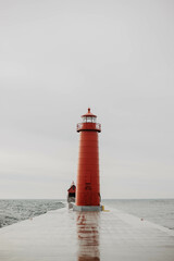red lighthouse on the water © Ryan