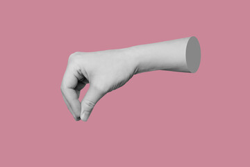 Female hand makes a gesture like holding something isolated on a pink background. Mockup with empty...