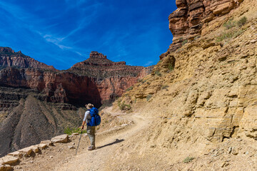 Fototapeta na wymiar Male Hiker on The South Kaibab Trail Below O'Neill Butte, Grand Canyon National Park, Arizona, USA