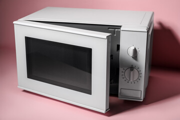 New modern microwave oven on pink background