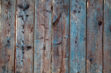 Naklejka premium Old blue wooden surface with peeling paint.