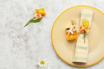 Table setting with honey bonbonniere on light background