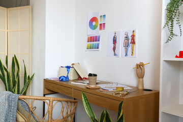 Workplace of clothes stylist in modern studio