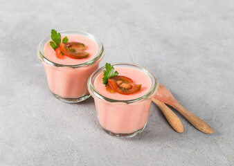 Vegan dish. Tomato cream pudding, Panna Cotta in a glass. Light gray background