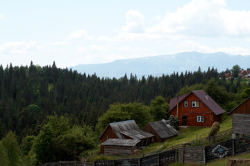Colorful mountain huts and houses in Ukrainian villages of Transcarpathia