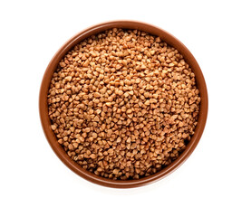 Bowl with buckwheat grains on white background