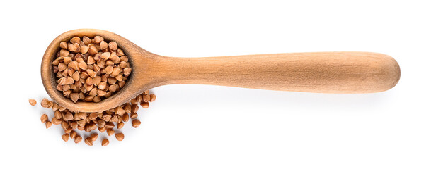 Wooden spoon with buckwheat on white background