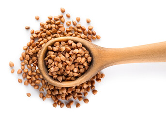 Wooden spoon with buckwheat on white background, closeup