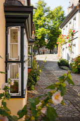 Fototapeta na wymiar Window of an ancient house in a beautiful street in the city of Lüneburg 