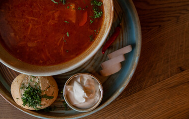 A plate of traditional beetroot borscht soup. Ukrainian borsch.Selective focus, close-up.