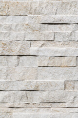 White wall texture with reliefs. Closeup. White background