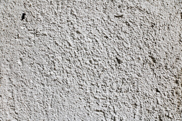 White wall texture with reliefs. Closeup. White background