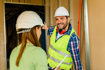 Architect and foreman meeting at construction site,Architect inspects the construction...