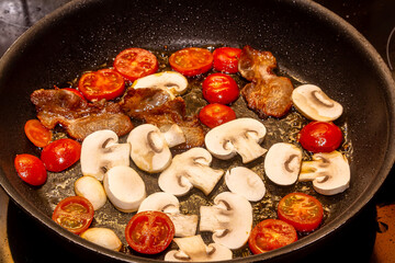 A delicious nutritious healthy breakfast with fried eggs, bacon, beans. Healthy eating at the beginning of the day.