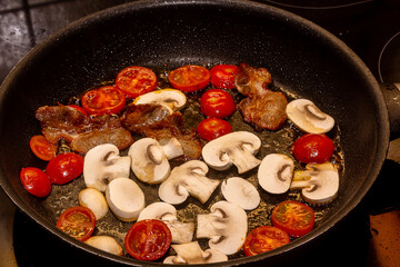A delicious nutritious healthy breakfast with fried eggs, bacon, beans. Healthy eating at the...