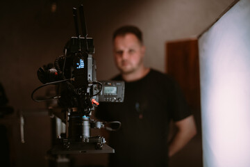 Director of photography with a camera in his hands on the set.