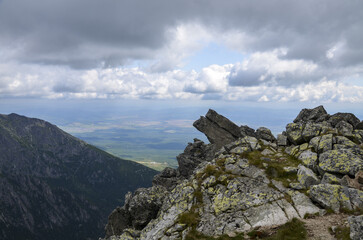 Grey stones and big boulders on the Rocky Surface against the sky with clouds at National Park High Tatras, Slovakia