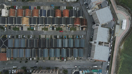 An aerial shot of houses nearby a beach in Okinawa Japan