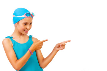 Girl with swimsuit and diving goggles, swimming lessons in the pool, pointing to the right. white background with copy space