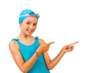 Girl with swimsuit and diving goggles, swimming lessons in the pool, pointing to the right. white...