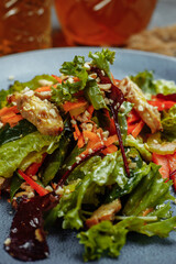 Healthy organic fresh salad with tomatoes, peppers and chicken Masala. Grilled chicken breasts and fresh vegetables in plate