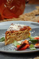 Homemade delicious Meat lasagna with basil leaf on the top. Close up. Recipe, menu. Italian cuisine. Side view