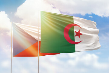 Sunny blue sky and flags of algeria and czechia