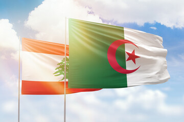 Sunny blue sky and flags of algeria and lebanon